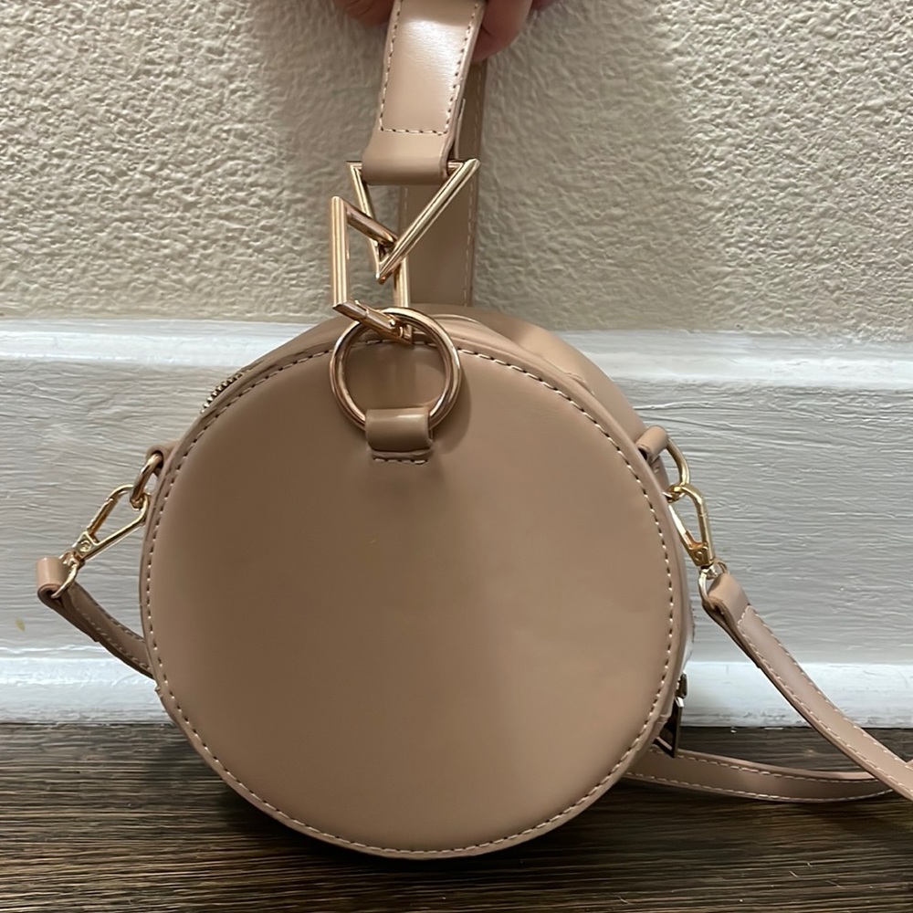 Tan round crossbody purse